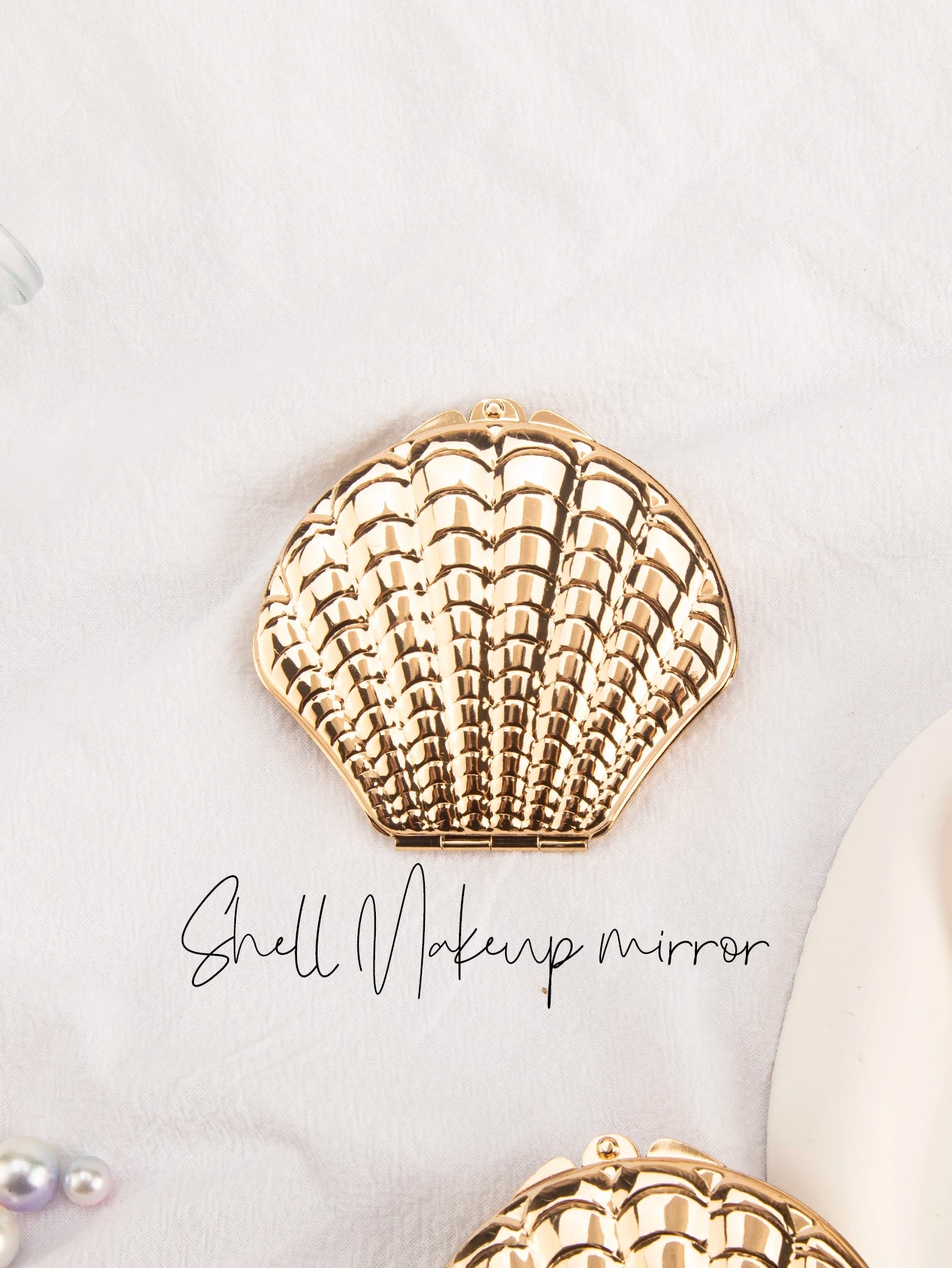 Miroir coquillage doré